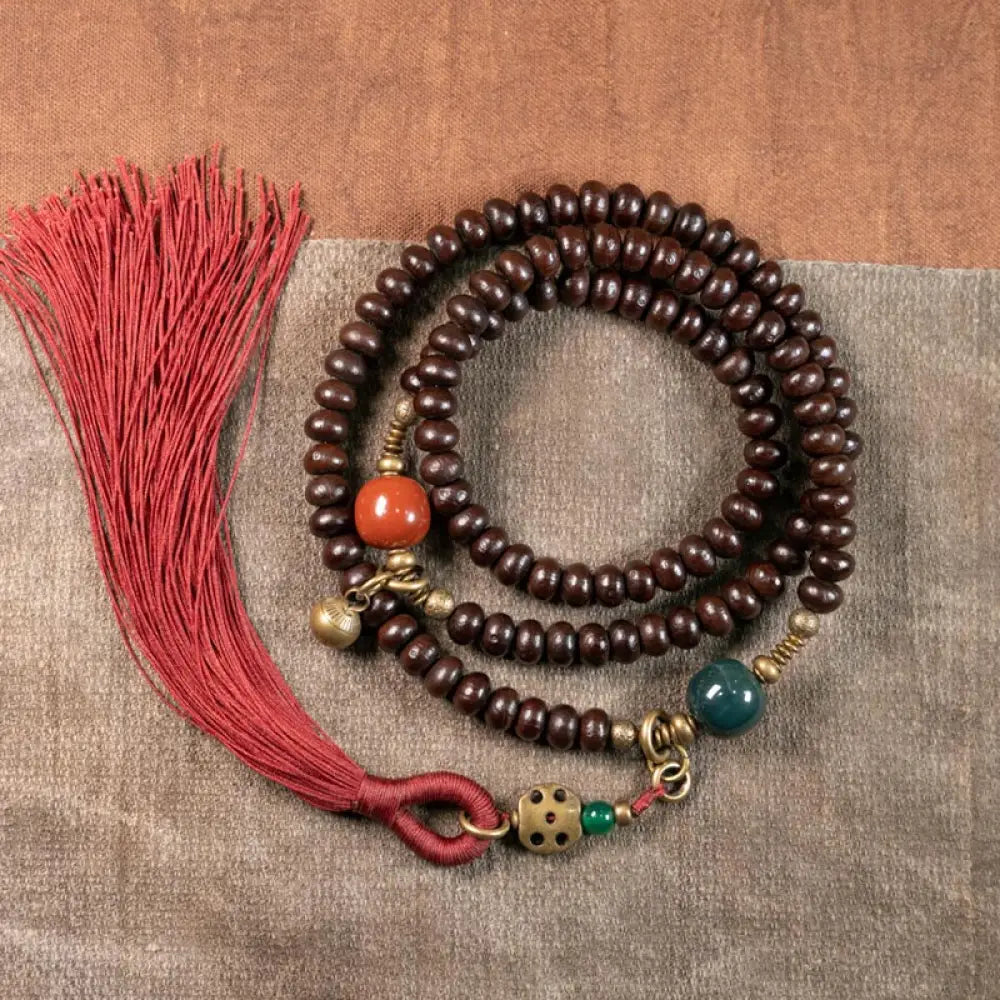 BWOOOH 108 Tibetan Purple Bodhi Seed Mala bracelet, accented with Alashan Agate and copper. A sacred amulet for meditation, spiritual protection, and enlightened awareness.