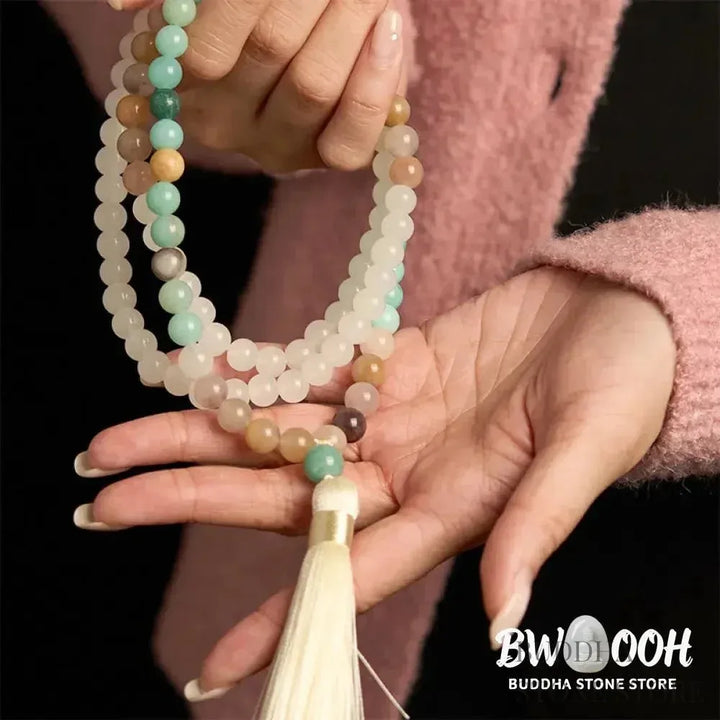 BWOOOH 108-bead Mala bracelet featuring 8mm natural white jade and amazonite beads with a delicate white tassel on premium elastic string, promoting healing and balance. - View 8