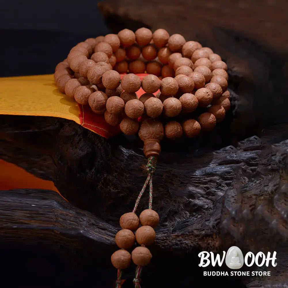 BWOOOH 108-bead Nepal Bodhi Seed Mala bracelet featuring varied 11-13mm dark-speckled seeds on premium string, with a symbolic tassel, designed for meditation and daily spiritual awareness. - View 2