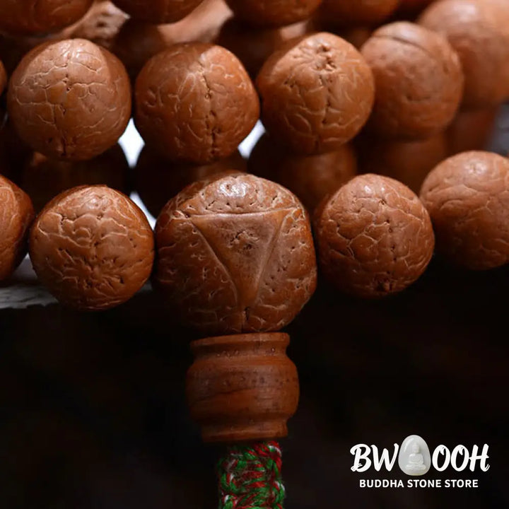 BWOOOH 108-bead Nepal Bodhi Seed Mala bracelet featuring varied 11-13mm dark-speckled seeds on premium string, with a symbolic tassel, designed for meditation and daily spiritual awareness. - View 7