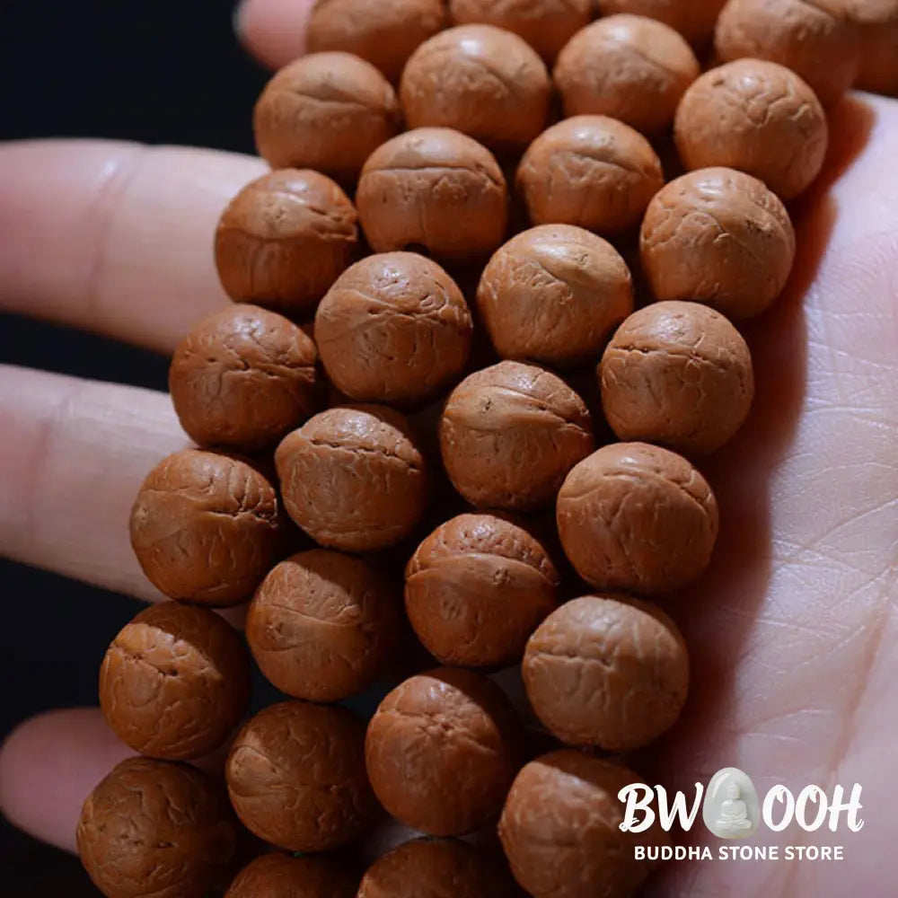 BWOOOH 108-bead Nepal Bodhi Seed Mala bracelet featuring varied 11-13mm dark-speckled seeds on premium string, with a symbolic tassel, designed for meditation and daily spiritual awareness. - View 8
