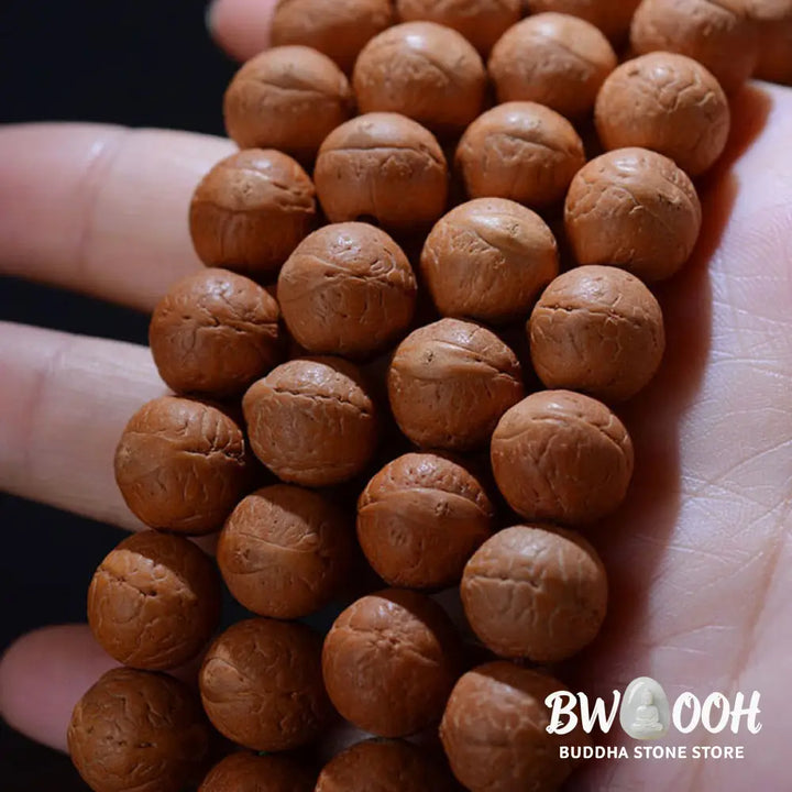 BWOOOH 108-bead Nepal Bodhi Seed Mala bracelet featuring varied 11-13mm dark-speckled seeds on premium string, with a symbolic tassel, designed for meditation and daily spiritual awareness. - View 8
