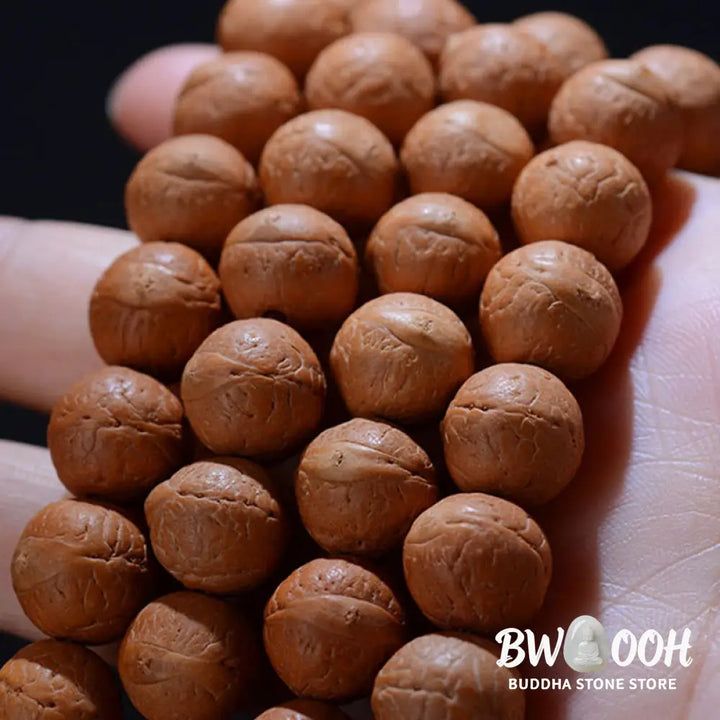 BWOOOH 108-bead Nepal Bodhi Seed Mala bracelet featuring varied 11-13mm dark-speckled seeds on premium string, with a symbolic tassel, designed for meditation and daily spiritual awareness. - View 4