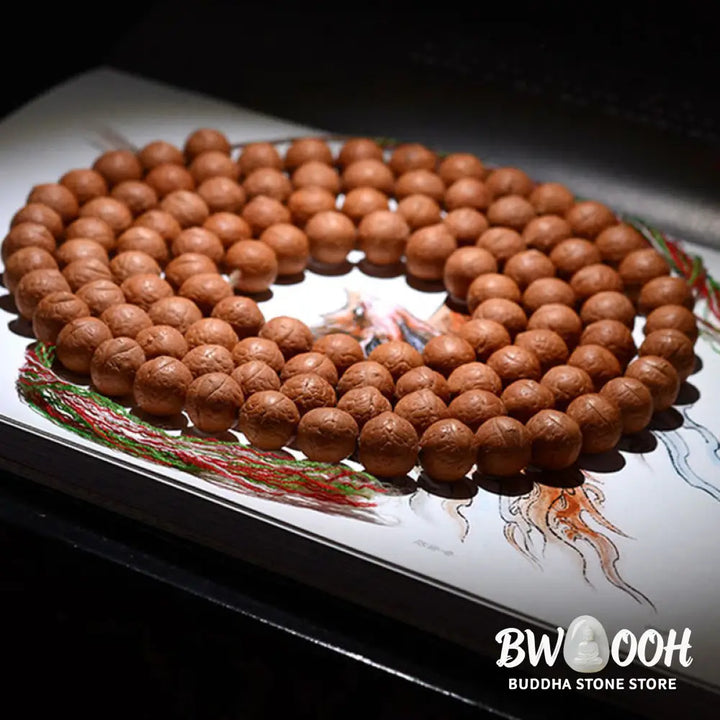A BWOOOH 108-bead Nepal Bodhi Seed Mala bracelet, handcrafted with unique dark-speckled seeds on premium string, for meditation, enlightenment, and positive energy. - View 10