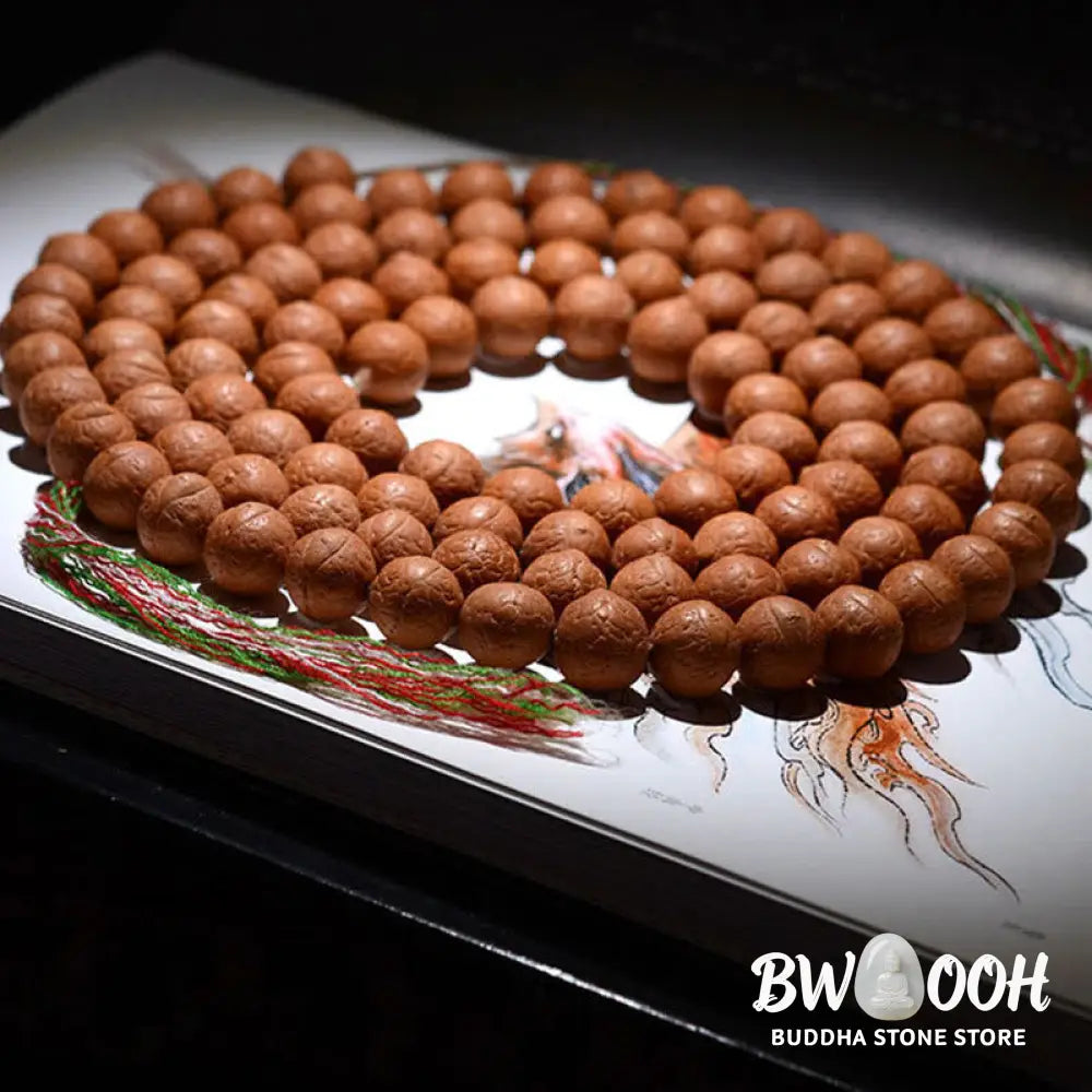 A BWOOOH 108-bead Nepal Bodhi Seed Mala bracelet, handcrafted with unique dark-speckled seeds on premium string, for meditation, enlightenment, and positive energy. - View 5
