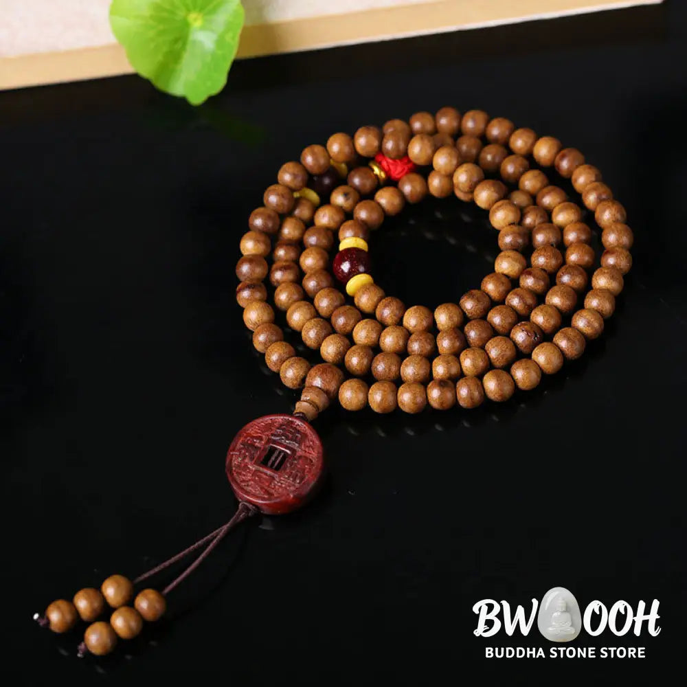 BWOOOH 108 Mala Beads handcrafted from natural Peach Wood and Bodhi Seeds, featuring a detailed Lotus charm, designed for mindful prayer and meditation. - View 8