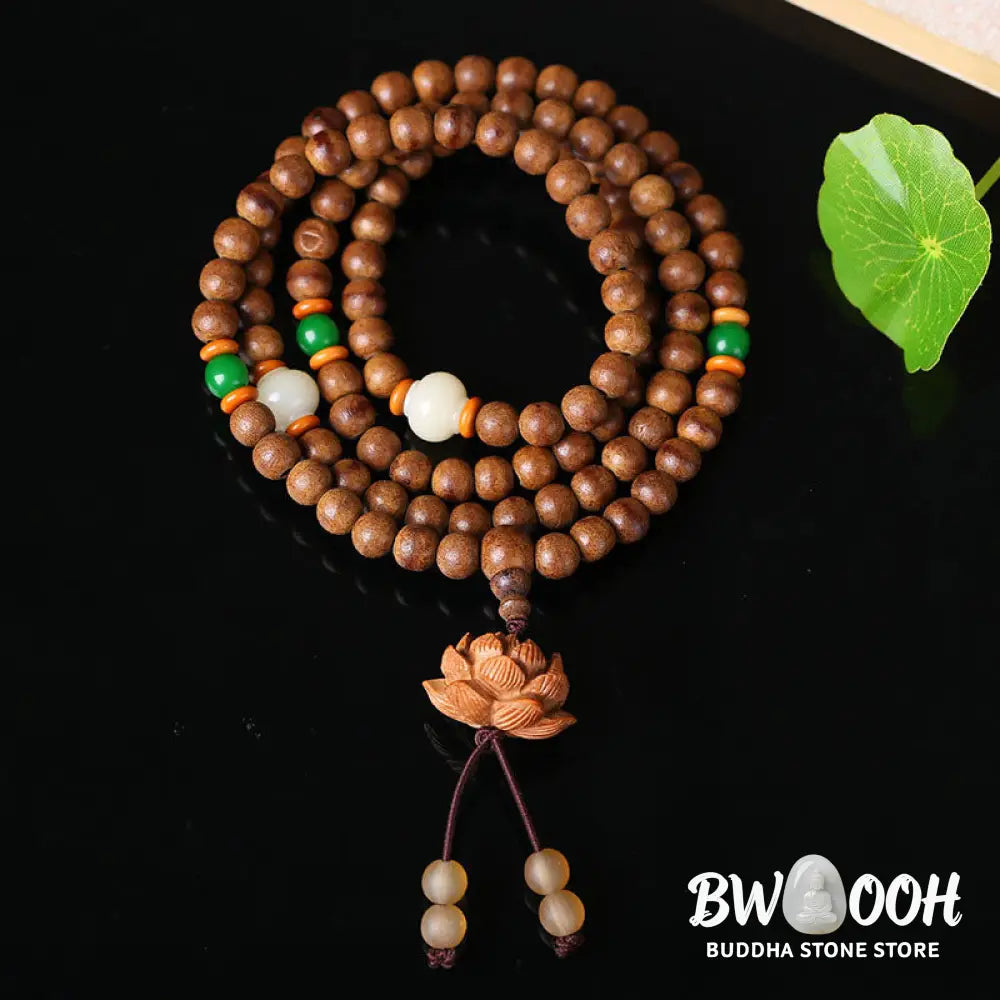 BWOOOH 108 Mala Beads handcrafted from natural Peach Wood and Bodhi Seeds, featuring a detailed Lotus charm, designed for mindful prayer and meditation. - View 4