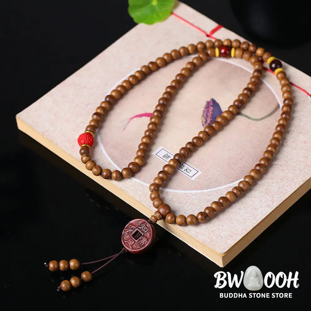 BWOOOH 108 Mala Beads handcrafted from natural Peach Wood and Bodhi Seeds, featuring a detailed Lotus charm, designed for mindful prayer and meditation. - View 7