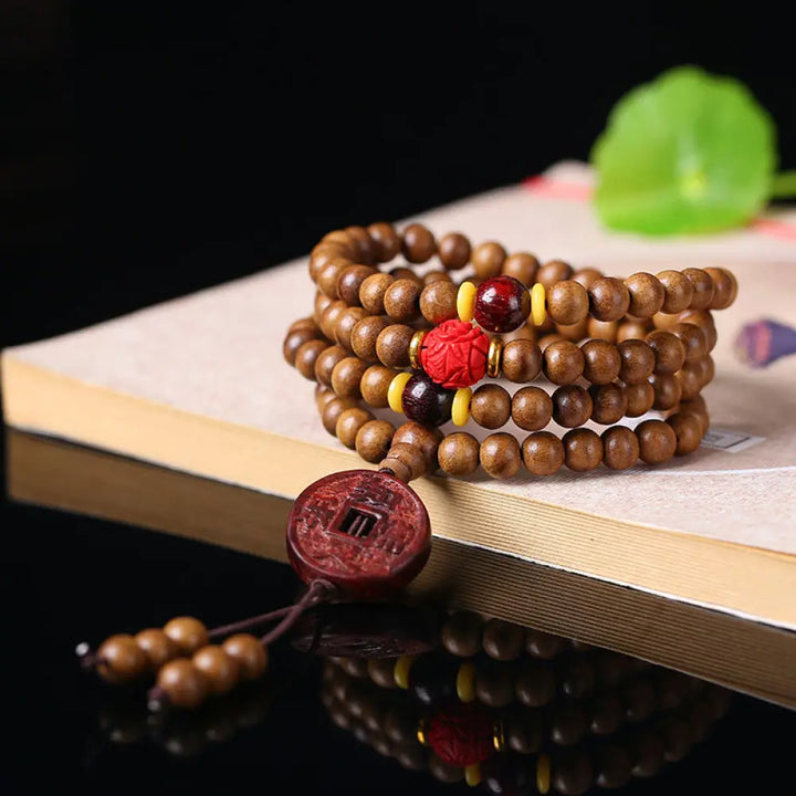 BWOOOH 108 Mala Beads handcrafted from natural Peach Wood and Bodhi Seeds, featuring a detailed Lotus charm, designed for mindful prayer and meditation. - View 5