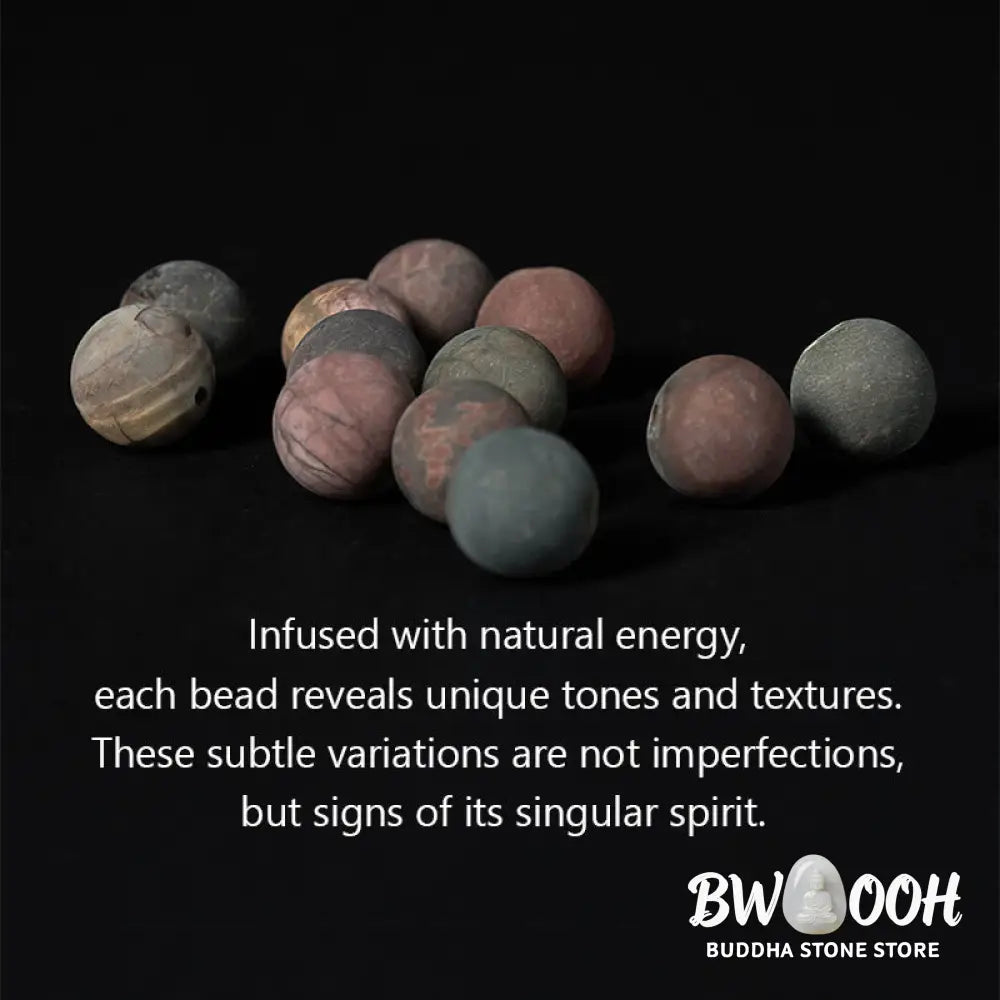 BWOOOH 108 Mala beads bracelet featuring naturally textured 8mm Picasso Jasper stones, accented with a delicate Lotus Symbol charm, symbolizing courage and spiritual resilience on an elastic band. - View 7