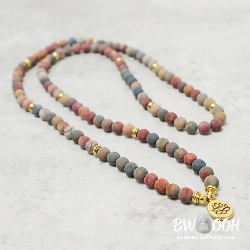 BWOOOH 108 Mala beads bracelet featuring naturally textured 8mm Picasso Jasper stones, accented with a delicate Lotus Symbol charm, symbolizing courage and spiritual resilience on an elastic band. - View 4