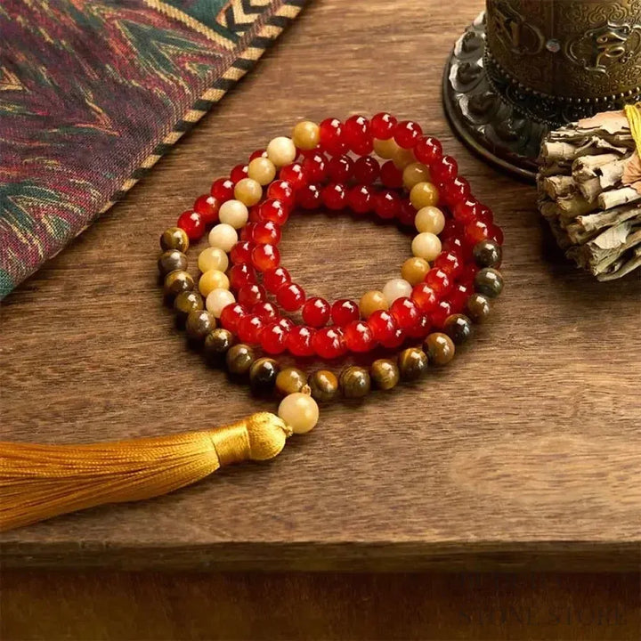 BWOOOH 108-bead Red Agate &amp; Tiger Eye mala bracelet with vibrant yellow tassel, handcrafted for Zen meditation, promoting emotional balance, inner strength, and focused tranquility.