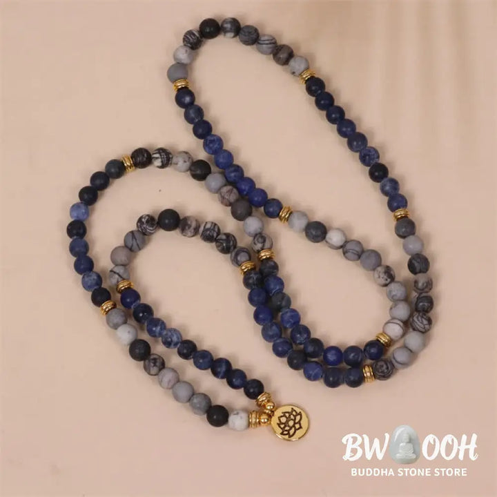 A BWOOOH 108-bead Mala bracelet featuring polished 8mm Sodalite and Zebra Jasper beads with a silver-toned alloy Lotus charm, strung on premium elastic. - View 4