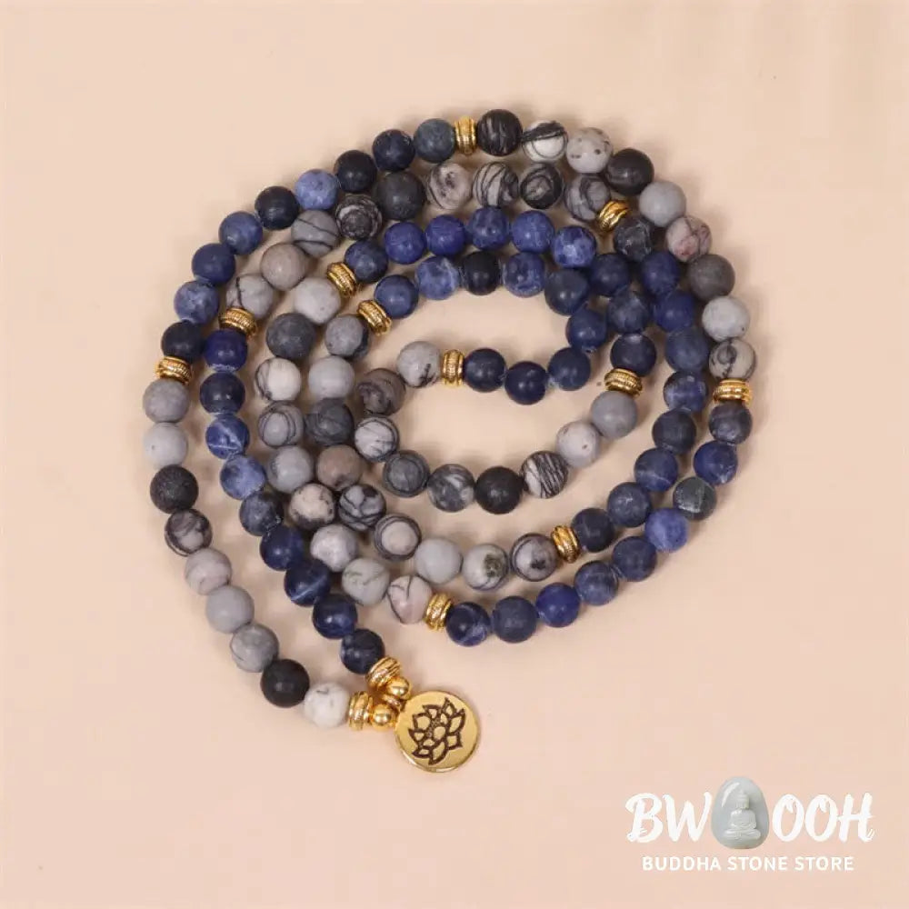 A BWOOOH 108-bead Mala bracelet featuring polished 8mm Sodalite and Zebra Jasper beads with a silver-toned alloy Lotus charm, strung on premium elastic. - View 3
