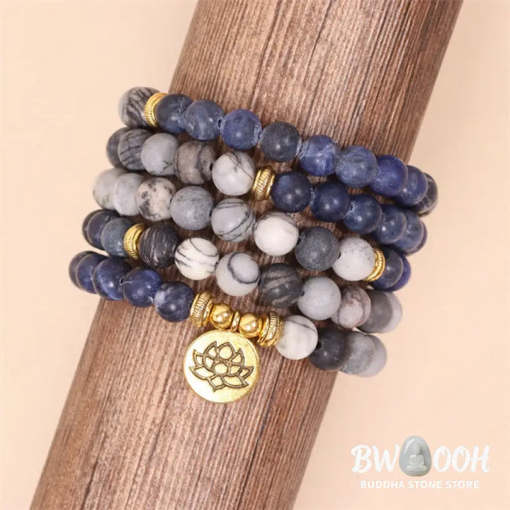 A BWOOOH 108-bead Mala bracelet featuring polished 8mm Sodalite and Zebra Jasper beads with a silver-toned alloy Lotus charm, strung on premium elastic. - View 5