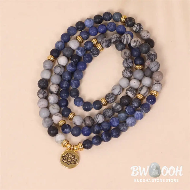 A BWOOOH 108-bead Mala bracelet featuring polished 8mm Sodalite and Zebra Jasper beads with a silver-toned alloy Lotus charm, strung on premium elastic. - View 2