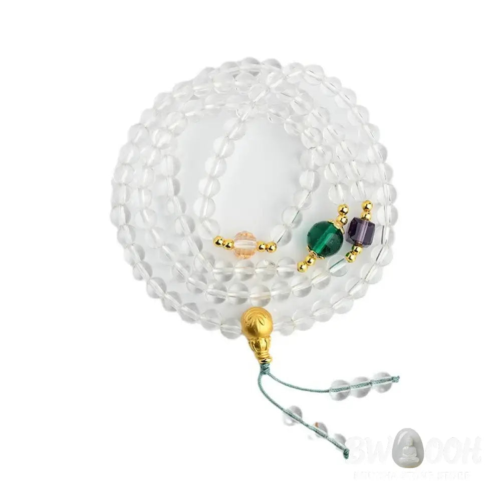 A close-up of the BWOOOH 108 Mala Beads White Crystal Clarity Bracelet, handcrafted with polished clear white crystal beads (7*9mm) on a premium elastic string, suitable for meditation and spiritual focus. The mala includes subtle alloy and Liuli accents, resting gently on a textured, serene background, highlighting its calming essence. - View 9