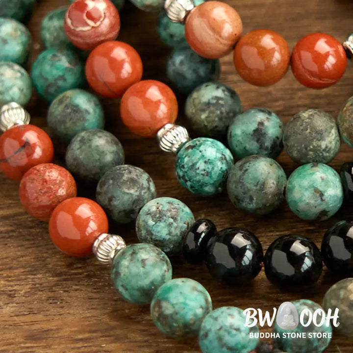 BWOOOH 108 Mala Protection Bracelet featuring 8mm natural Black Onyx, Red Jasper, and Turquoise beads, with a detailed Buddha Head charm and traditional tassel, displayed as a meditation accessory for spiritual balance and personal empowerment. - View 6