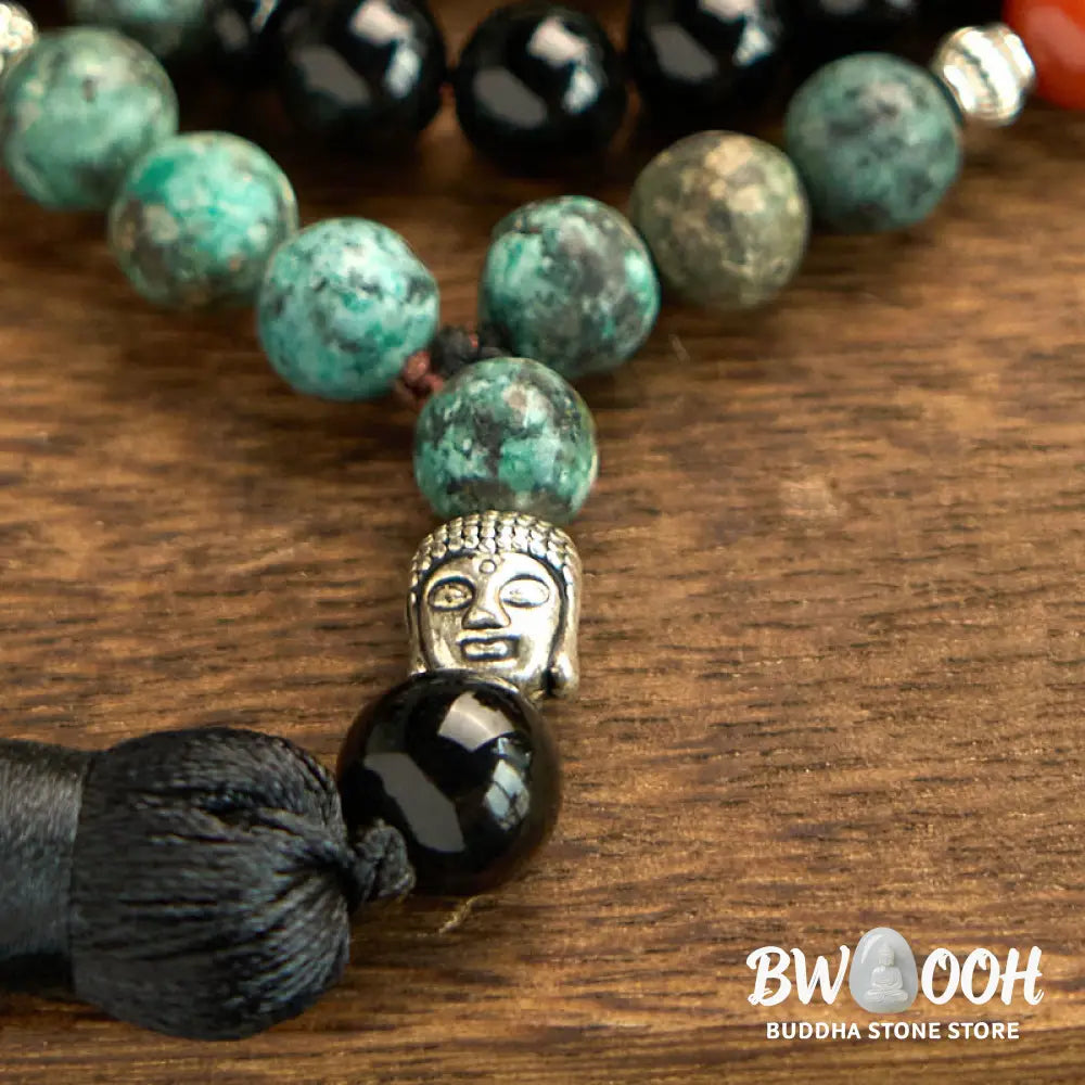 BWOOOH 108 Mala Protection Bracelet featuring 8mm natural Black Onyx, Red Jasper, and Turquoise beads, with a detailed Buddha Head charm and traditional tassel, displayed as a meditation accessory for spiritual balance and personal empowerment. - View 7