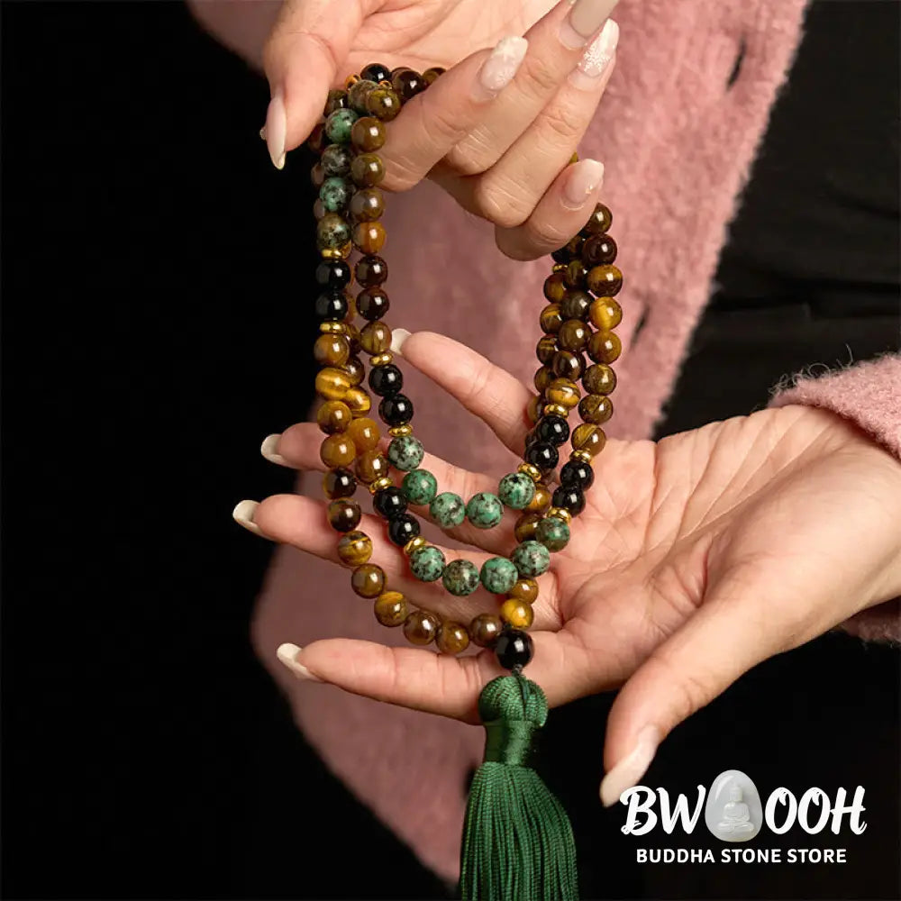 BWOOOH 108 Mala meditation bracelet featuring polished 8mm Tiger Eye and Turquoise beads, with a traditional tassel, symbolizing protection, courage, and balance for spiritual growth and mindful practice. - View 3