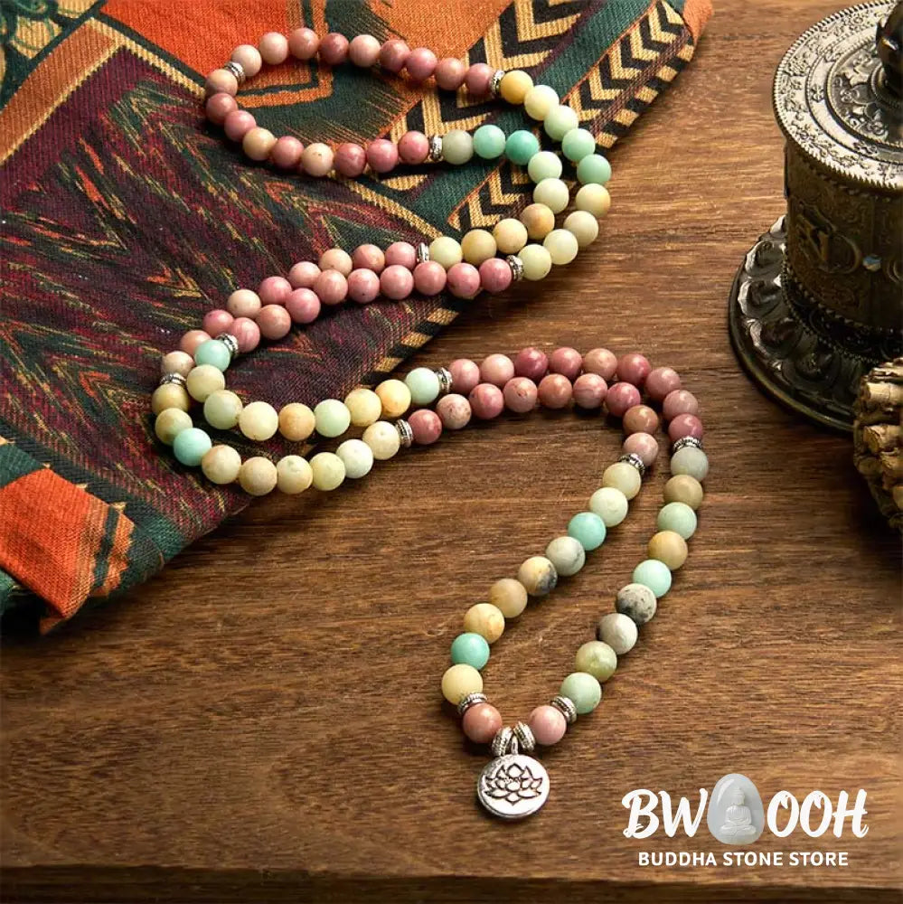 BWOOOH 108 Mala bracelet featuring polished 8mm Rhodonite and Amazonite beads, adorned with a round, intricately engraved Lotus charm, symbolizing compassion and inner harmony. - View 2
