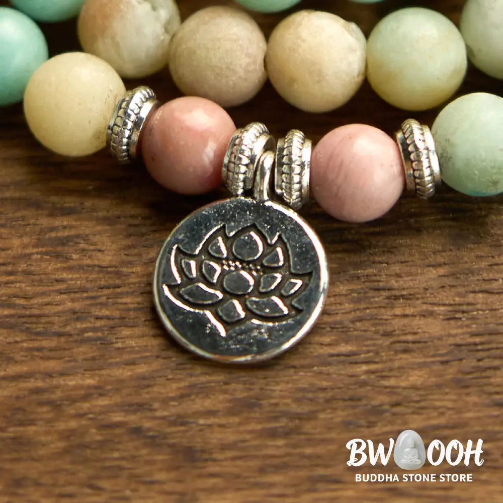 BWOOOH 108 Mala bracelet featuring polished 8mm Rhodonite and Amazonite beads, adorned with a round, intricately engraved Lotus charm, symbolizing compassion and inner harmony. - View 6
