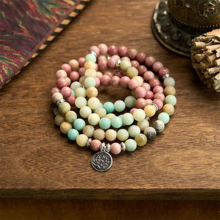 BWOOOH 108 Mala bracelet featuring polished 8mm Rhodonite and Amazonite beads, adorned with a round, intricately engraved Lotus charm, symbolizing compassion and inner harmony.