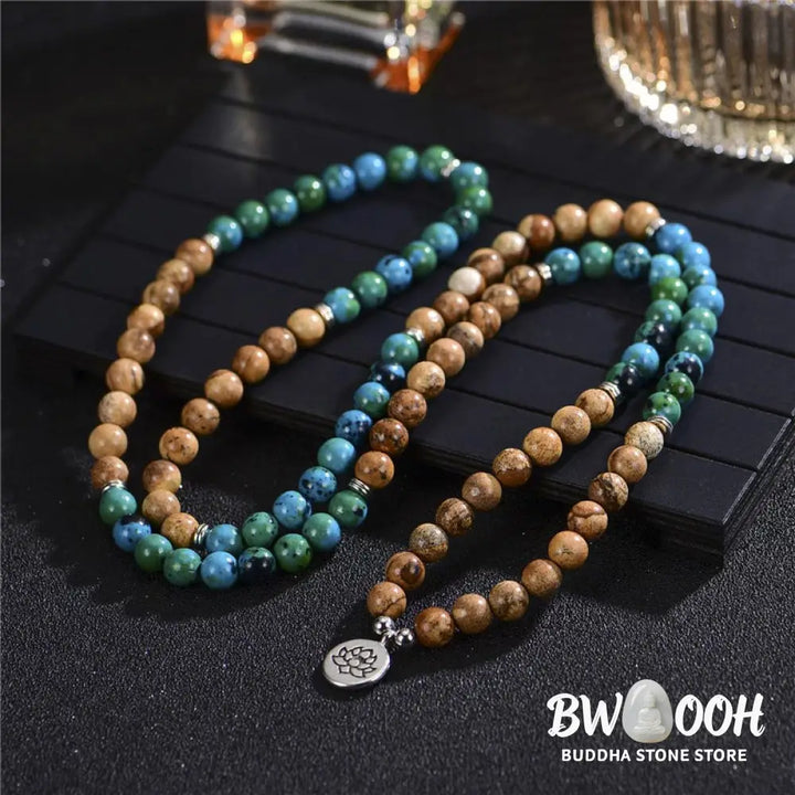 BWOOOH 108-bead meditation mala crafted from natural bodhi seed and speckled picture jasper, featuring a delicate lotus symbol pendant, worn as a multilayer bracelet or necklace. - View 2