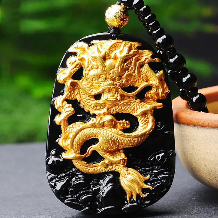 BWOOOH 18k gold-plated dragon obsidian pendant necklace, featuring a carved black obsidian dragon on a golden-hued base, showcasing its protective energy and luxurious finish.