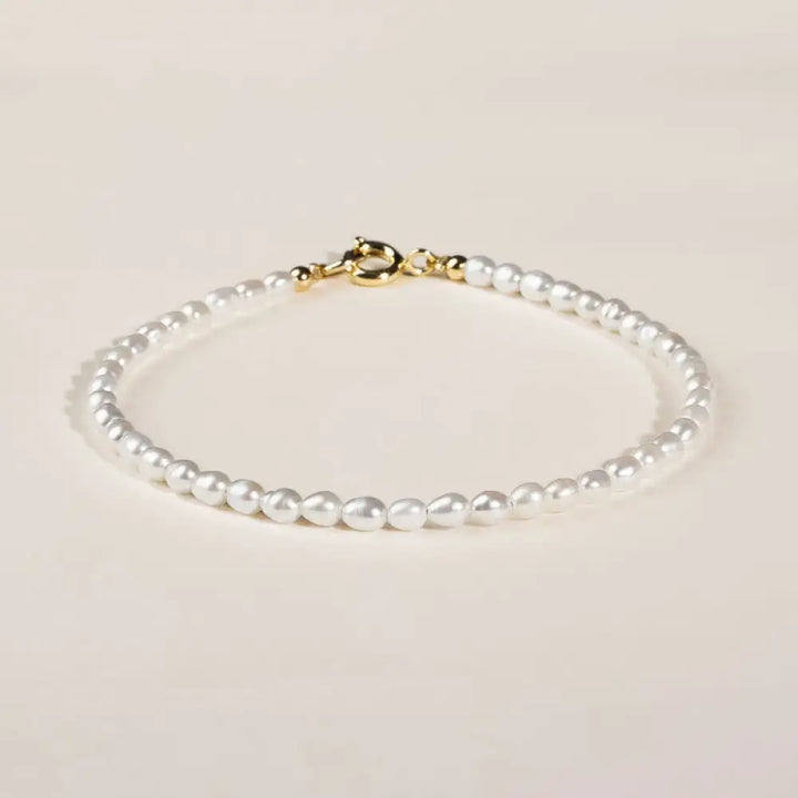 BWOOOH 2mm natural pearl wisdom bracelet with 14k gold accents.