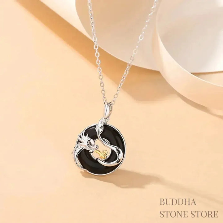 A BWOOOH 925 Sterling Silver Dragon Phoenix Peace Buckle necklace pendant featuring a polished natural Black Onyx and subtle Chalcedony inlay, symbolizing protection, inner peace, and harmonious balance. Ideal for Year of the Dragon alignment. - View 2
