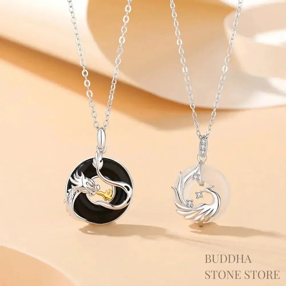 A BWOOOH 925 Sterling Silver Dragon Phoenix Peace Buckle necklace pendant featuring a polished natural Black Onyx and subtle Chalcedony inlay, symbolizing protection, inner peace, and harmonious balance. Ideal for Year of the Dragon alignment.