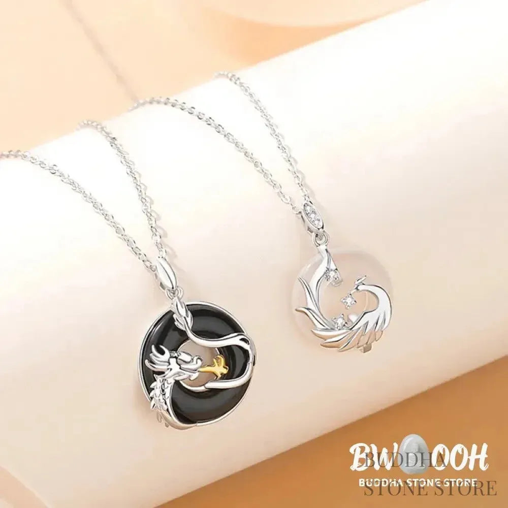 A BWOOOH 925 Sterling Silver Dragon Phoenix Peace Buckle necklace pendant featuring a polished natural Black Onyx and subtle Chalcedony inlay, symbolizing protection, inner peace, and harmonious balance. Ideal for Year of the Dragon alignment. - View 3