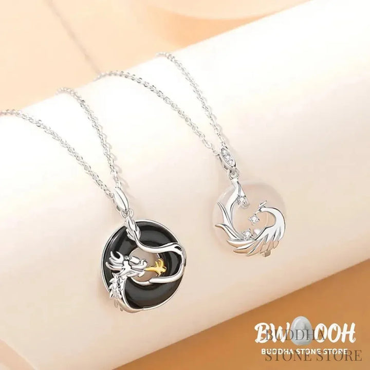A BWOOOH 925 Sterling Silver Dragon Phoenix Peace Buckle necklace pendant featuring a polished natural Black Onyx and subtle Chalcedony inlay, symbolizing protection, inner peace, and harmonious balance. Ideal for Year of the Dragon alignment. - View 3