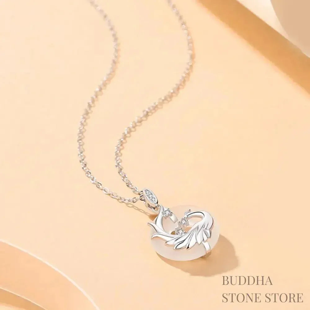 A BWOOOH 925 Sterling Silver Dragon Phoenix Peace Buckle necklace pendant featuring a polished natural Black Onyx and subtle Chalcedony inlay, symbolizing protection, inner peace, and harmonious balance. Ideal for Year of the Dragon alignment. - View 6