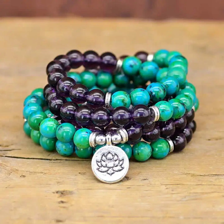 A BWOOOH Amethyst and Green Aventurine spiritual bracelet featuring a delicate silver-tone Lotus charm, handcrafted on an elastic string, showcasing vibrant purple and soothing green natural crystal beads for inner peace, stress relief, and emotional balance.