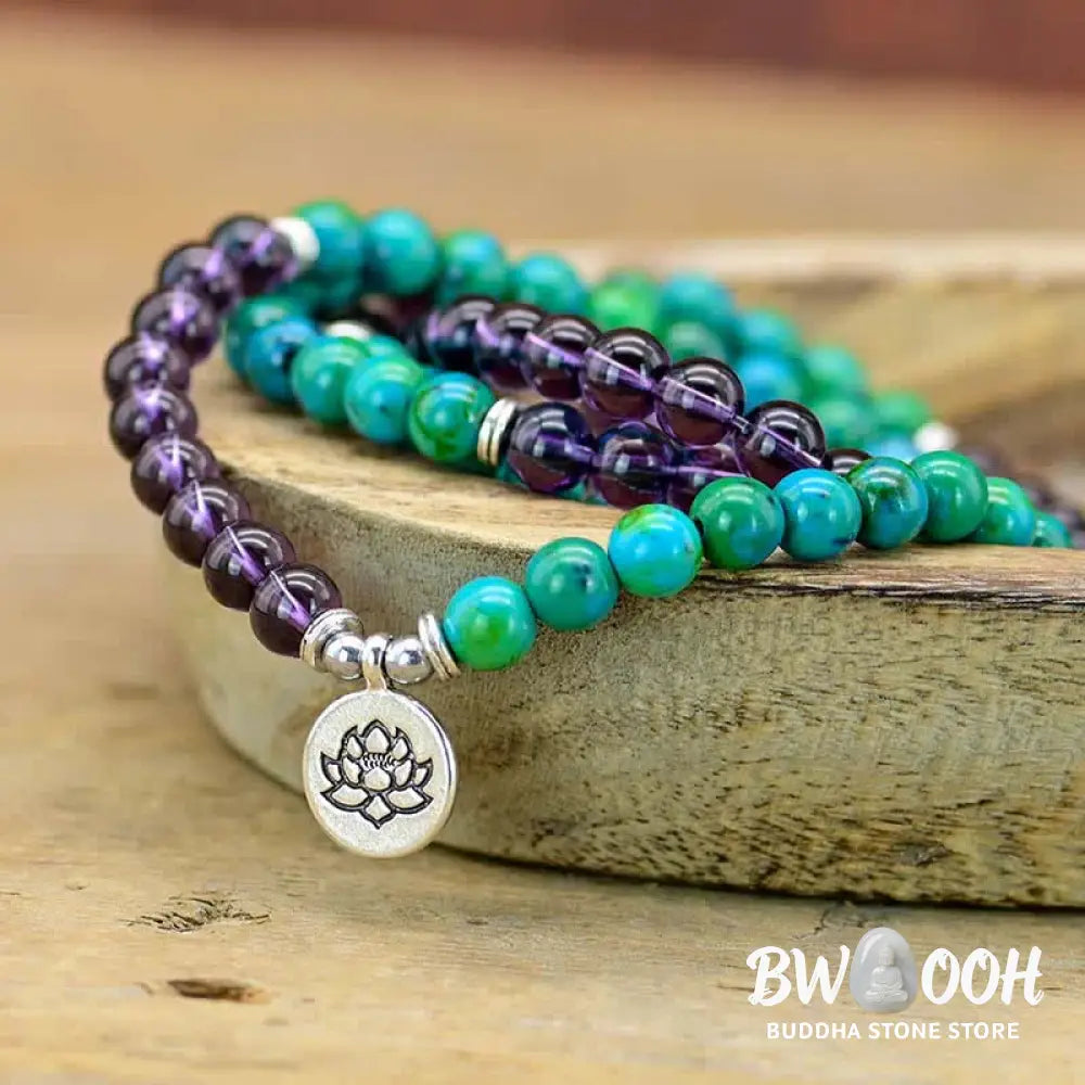 A BWOOOH Amethyst and Green Aventurine spiritual bracelet featuring a delicate silver-tone Lotus charm, handcrafted on an elastic string, showcasing vibrant purple and soothing green natural crystal beads for inner peace, stress relief, and emotional balance. - View 2