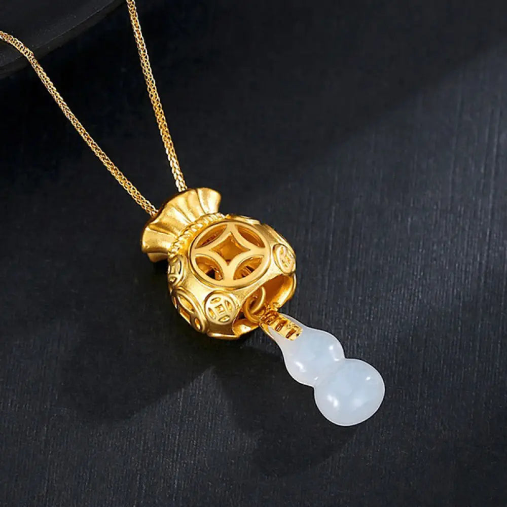 A BWOOOH Auspicious Feng Shui Money Bag Jade Pendant Necklace, featuring a 15x20MM jade money bag design crafted from White and Cyan Jade, set in 24K Gold Plated Copper, symbolizing protection, luck, and abundance.