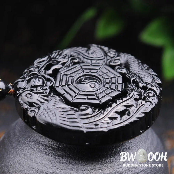 BWOOOH Bagua Dragon Phoenix Obsidian Fulfilment Pendant Necklace, featuring a 50x50x10mm carved black obsidian pendant with intricate Bagua, dragon, and phoenix symbols, suspended on an adjustable unisex cord. - View 3