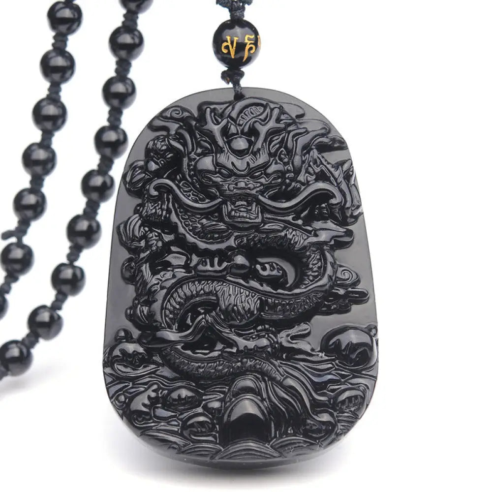 BWOOOH Black Obsidian Stone Dragon Fulfilment Pendant Necklace, a unisex, hand-carved natural black obsidian dragon (51x33x9mm) worn as a powerful energy shield, grounding the root chakra and attracting positive Feng Shui energy.