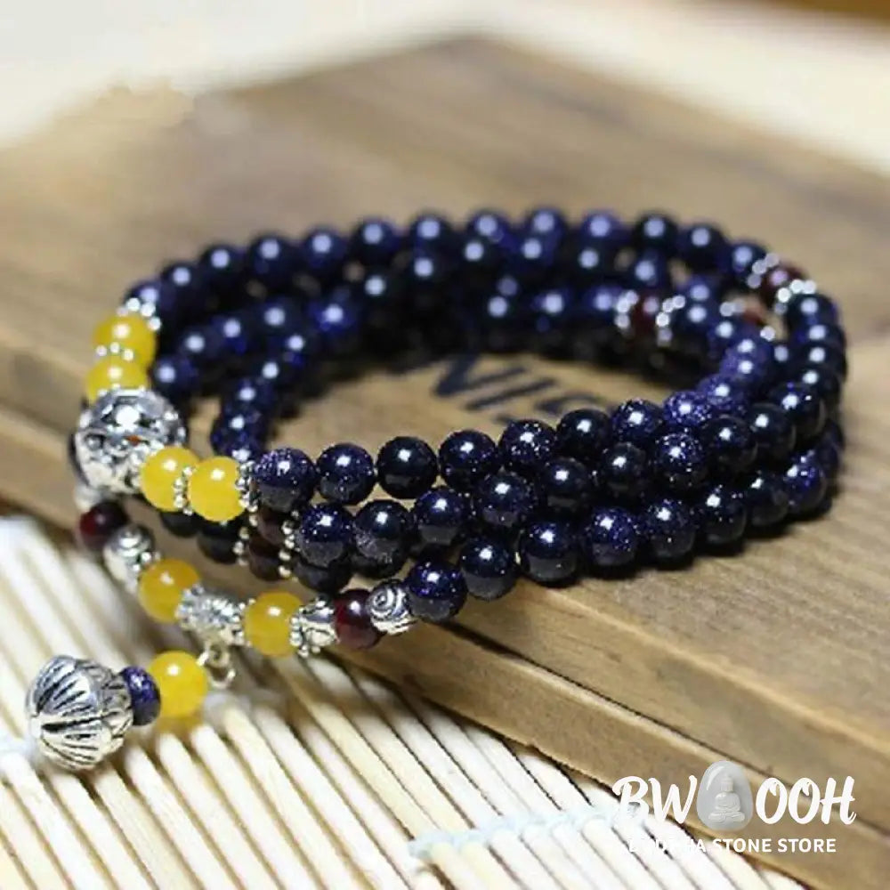 BWOOOH Blue Sandstone Wealth Charm Mala. Deep blue 6mm beads with sparkling inclusions, mimicking a starry night. Promotes courage, calm, and wealth for focused meditation. - View 2