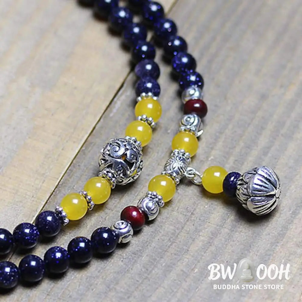 BWOOOH Blue Sandstone Wealth Charm Mala. Deep blue 6mm beads with sparkling inclusions, mimicking a starry night. Promotes courage, calm, and wealth for focused meditation. - View 6