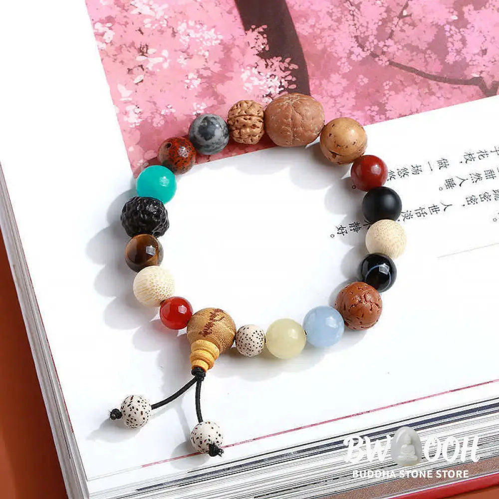 BWOOOH Bodhi Seed Agate Wisdom Harmony Wrist Mala Bracelet featuring dark Bodhi seeds, vibrant red stone, and polished agate beads on a premium elastic string, handmade for meditation and spiritual focus. - View 2