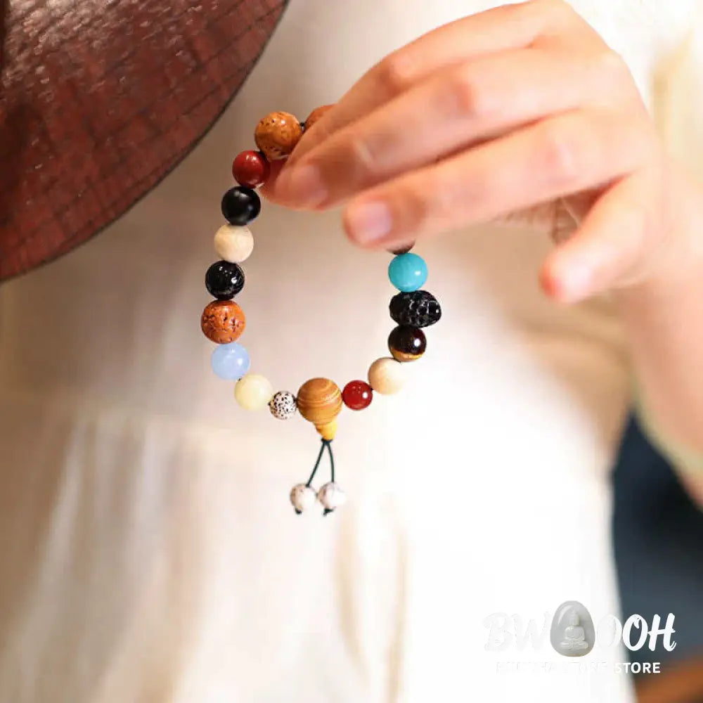 BWOOOH Bodhi Seed Agate Wisdom Harmony Wrist Mala Bracelet featuring dark Bodhi seeds, vibrant red stone, and polished agate beads on a premium elastic string, handmade for meditation and spiritual focus. - View 3