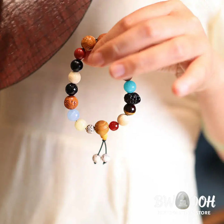 BWOOOH Bodhi Seed Agate Wisdom Harmony Wrist Mala Bracelet featuring dark Bodhi seeds, vibrant red stone, and polished agate beads on a premium elastic string, handmade for meditation and spiritual focus. - View 3