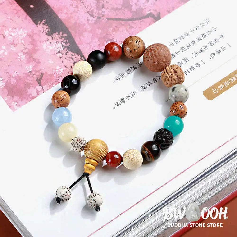 BWOOOH Bodhi Seed Agate Wisdom Harmony Wrist Mala Bracelet featuring dark Bodhi seeds, vibrant red stone, and polished agate beads on a premium elastic string, handmade for meditation and spiritual focus. - View 6
