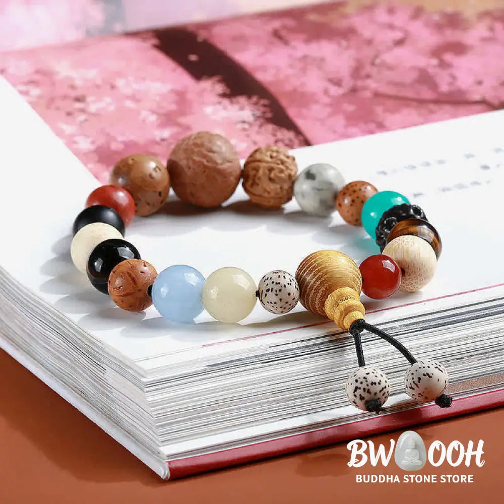 BWOOOH Bodhi Seed Agate Wisdom Harmony Wrist Mala Bracelet featuring dark Bodhi seeds, vibrant red stone, and polished agate beads on a premium elastic string, handmade for meditation and spiritual focus. - View 5