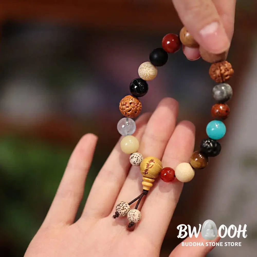 BWOOOH Bodhi Seed Agate Wisdom Harmony Wrist Mala Bracelet featuring dark Bodhi seeds, vibrant red stone, and polished agate beads on a premium elastic string, handmade for meditation and spiritual focus. - View 4