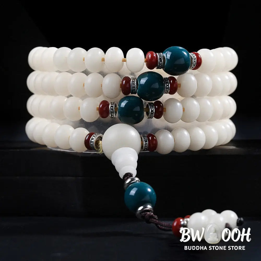 A close-up of the BWOOOH Bodhi Seed Lotus Blessing Charm Bracelet, featuring naturally dark-speckled bodhi seed beads alongside a delicate lotus symbol charm, suitable for unisex wear. - View 2