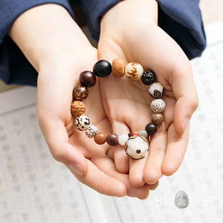 Handcrafted BWOOOH Bodhi Seed Lotus Wisdom Peace Wrist Mala Bracelet, featuring 18 naturally varied bodhi seeds and a delicately engraved lotus symbol, embodying enlightenment, calm, and renewed spiritual focus. - View 7